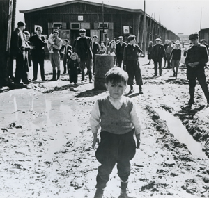 Displaced Persons camp in Salzburg, Austria, with unidentified young boy in the foreground