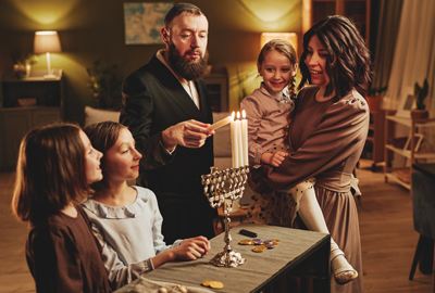 Traditional Jewish Family Lighting Menorah